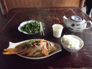 $5 dinner in China. The fish had been swimming in the bathroom sink minutes before. Delish
